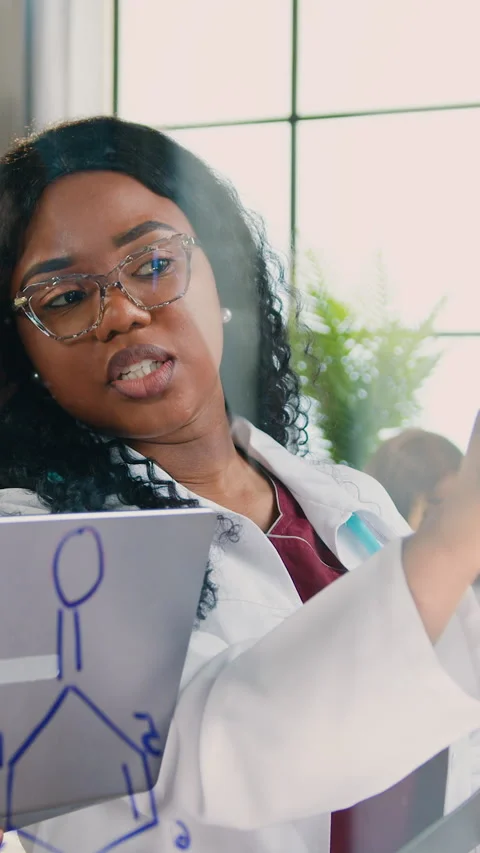 Work in medical lab of good-looking intelligent high-skilled male and female med Stock Footage 329322003