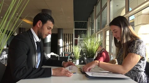 Work meeting between a man and a woman Stock Footage 124857961