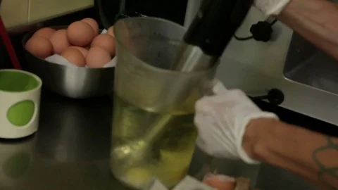 Work at the mixer in the kitchen of a restaurant Stock Footage 82176287
