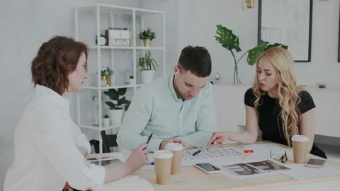 Work in a modern architectural creative agency. Employees present and suggesting Stock Footage 106192422