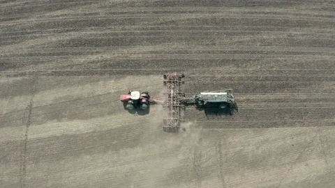The work of a modern seeding complex in the field. Aerial photography Видео 151496311
