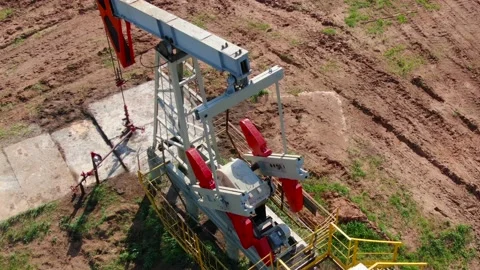 The work of an oil rig close-up. Engine, pump, rocking chair. Stock Footage 154336523