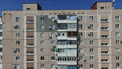 The work on the outer Insulate of an apartment house Stock Footage 88880721