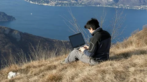 Work on the PC in the mountains Stock Footage 59712680