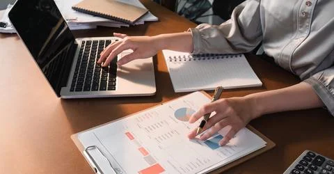 Work performance summary report Asian woman working online and planning Stock Photos