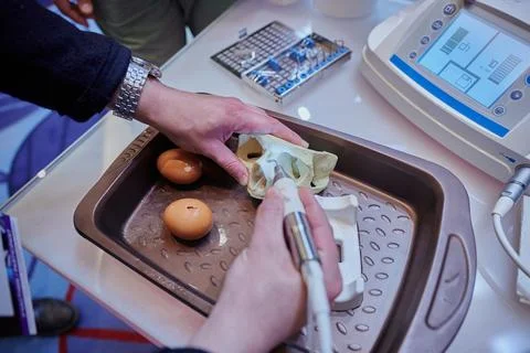 Work with a piezo instrument in the educational process of bone processing Stock Photos