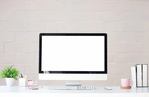 Work place with blank screen computer pc and office supplies on white table.. Stock Photos