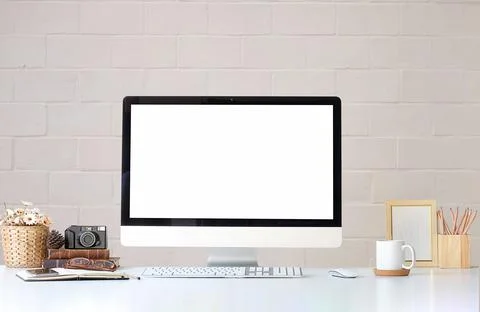 Work place with blank screen computer pc and office supplies on white table.. Stock Photos
