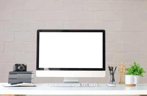 Work place with blank screen computer pc and office supplies on white table.. Stock Photos