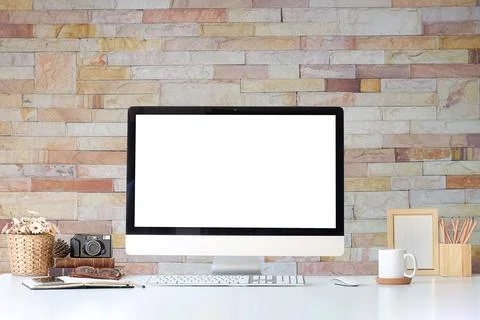 Work place with blank screen computer pc and office supplies on white table.. Stock Photos
