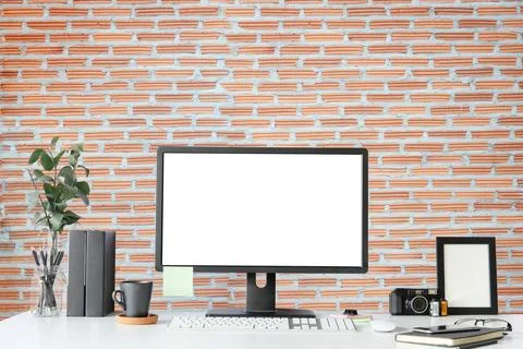 Work place with blank screen computer pc and office supplies on white table.. Stock Photos