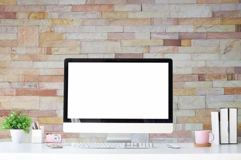 Work place with blank screen computer pc and office supplies on white table.. Stock Photos