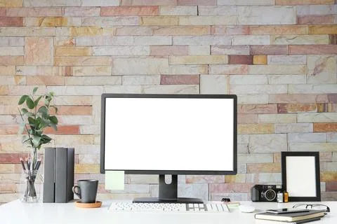 Work place with blank screen computer pc and office supplies on white table.. Stock Photos