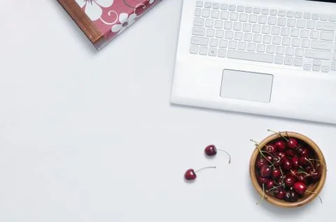 Work place with cherries for break Stock Photos