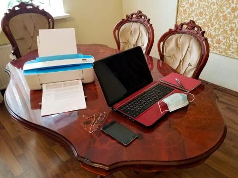 Work place at home for remote work or study during a pandemic. Laptop, printe Stock Photos
