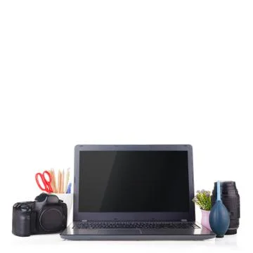 Work place with laptop and camera equipment. Stock Photos