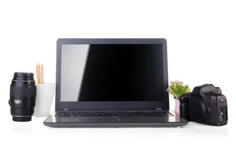 Work place with laptop and camera equipment. Stock Photos