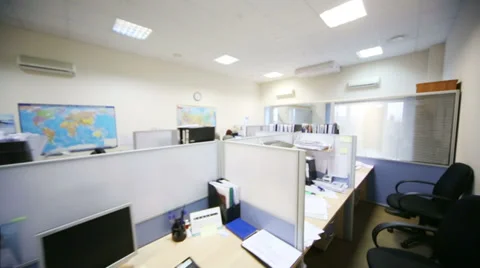 Work places with computers and papers separated by partitions Stock Footage 38163117