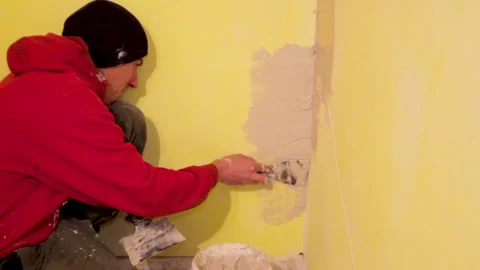 Work on plastering the wall in the room Video stock 148265264