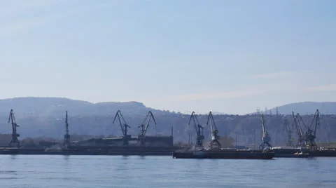 The work of port cranes on the river timelapse Stock Footage 62503308