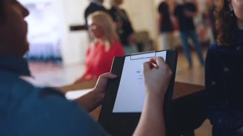 The work of a portrait painter, the artist draws a portrait of a person Stock Footage 238752172