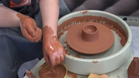 Work on a potter's wheel, hands close-up. Stock Footage 93837239