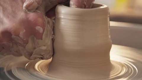 Work in the pottery workshop: clay ware on the potter's wheel Stock Footage 83460315