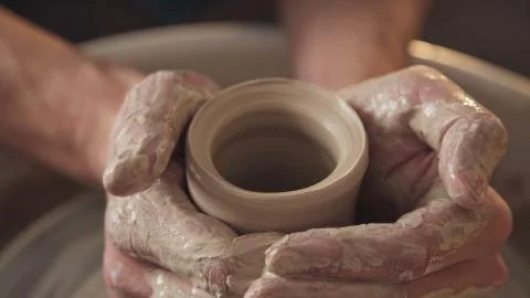Work in the pottery workshop: clay ware on the potter's wheel Stock Photos
