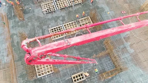 Work on pouring concrete in a pit at a construction site Video stock 219431848