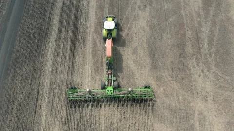 The work of a powerful, modern seeding complex in the field. Aerial photogra Stock Footage 151496332