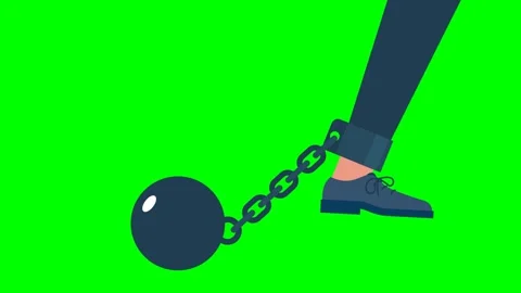 Work problem. Chain with a ball attached to a leg. The man's leg is chained Stock Footage 293735802
