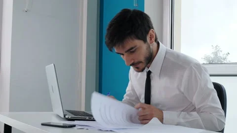 Work, problems - stressed manager at computer throws the pen in a rage Video stock 141742277