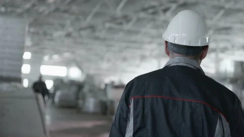 Work Process of Engineer Mechanic at Large Structure. Looking Male Person in Har Stock Footage 199475846