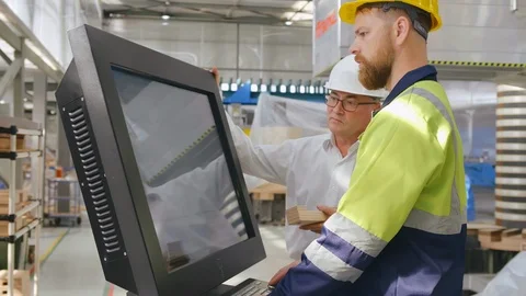 Work process at factory. Senior mechanical engineer and worker in uniform and Stock Footage 121868905