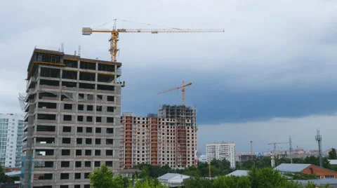 Work process tower cranes thunderstorm on background Stock Footage 68951937