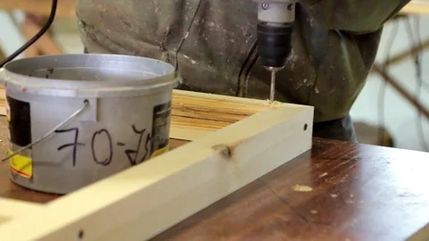 Work on production with natural material. Master works with a screwdriver. With Stock Footage 94137716