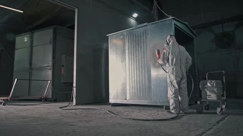 Work of a professional painter in protective uniform in the paint shop Stock-Footage 265509733