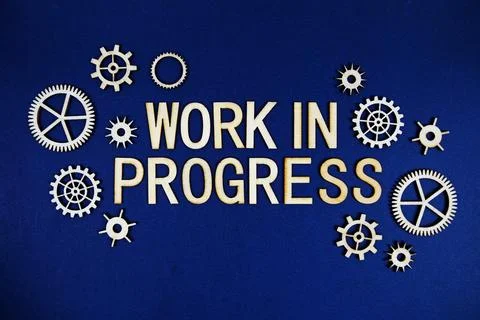Work In Progress alphabet letters with gears element on navy blue background Stock Photos