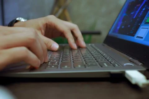 Work in Progress: Close-Up View of Hands Busy Typing on a Laptop Keyboard Stock Photos