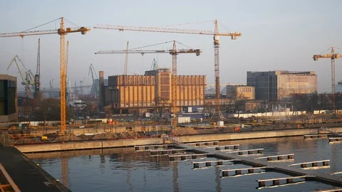 Work in progress cranes at harbour or port in the seafront Stock Footage 109396123
