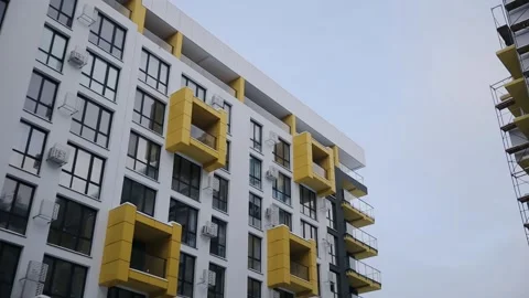 Work in progress on a new modern high-rise apartment building with windows and Stock Footage 259208373