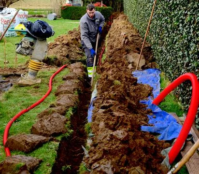 Work in progress: placing red flexible tube Stock Photos