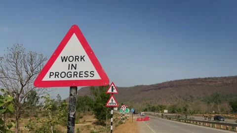 Work in Progress Road Sign Along Highway Stock Footage 337244243