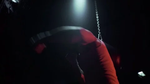 Work the punches of the boxer on the bag. Dark room, red light Stock Footage 80862162