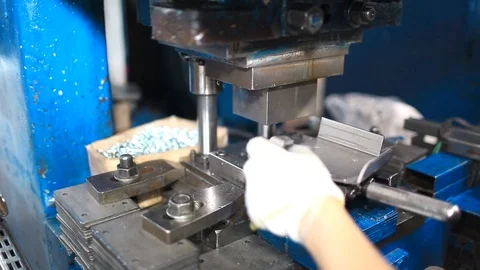 Work puts the item under the press. Creation of new parts under pressure at the Stock Footage 95007952