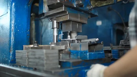 Work puts the item under the press. Creation of new parts under pressure at the Stock Footage 95007968