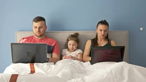 Work remotely. Young couple forced to work at home due to quarantine. The child Stock Footage 130331585