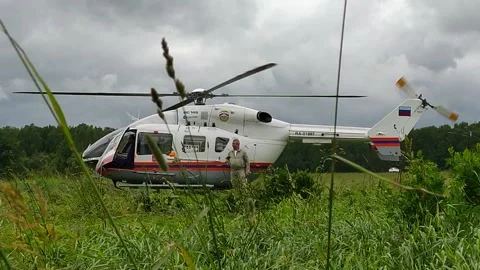 The work of a rescue helicopter on the field Stock Footage 158094713