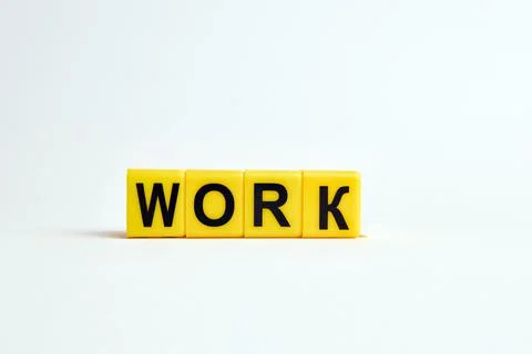 The work robot consists of individual cubes with letters. Stock Photos
