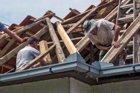 Work on the roof of the house Stock Photos